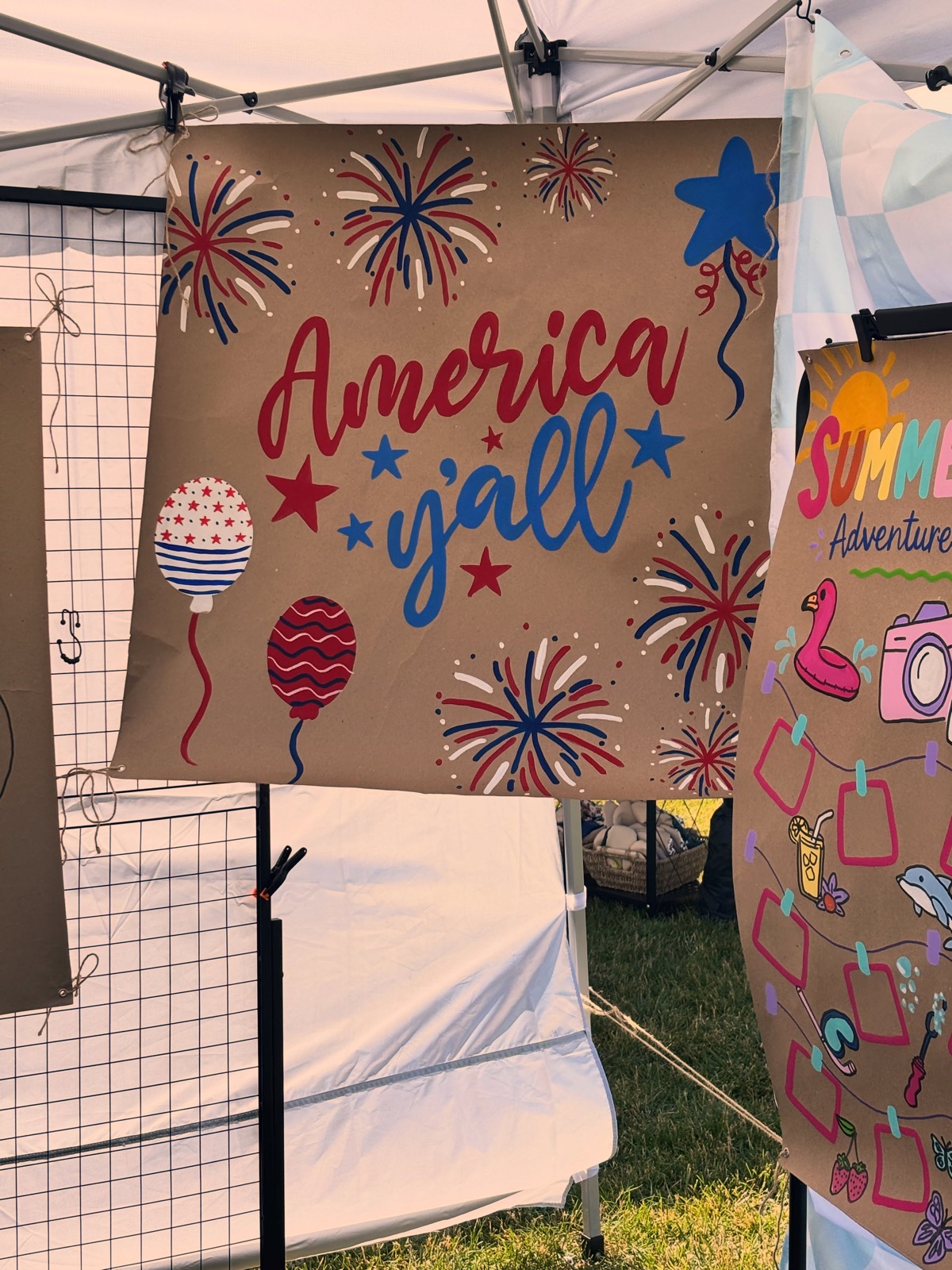 Patriotic 'America y'all' banner with fireworks and balloons